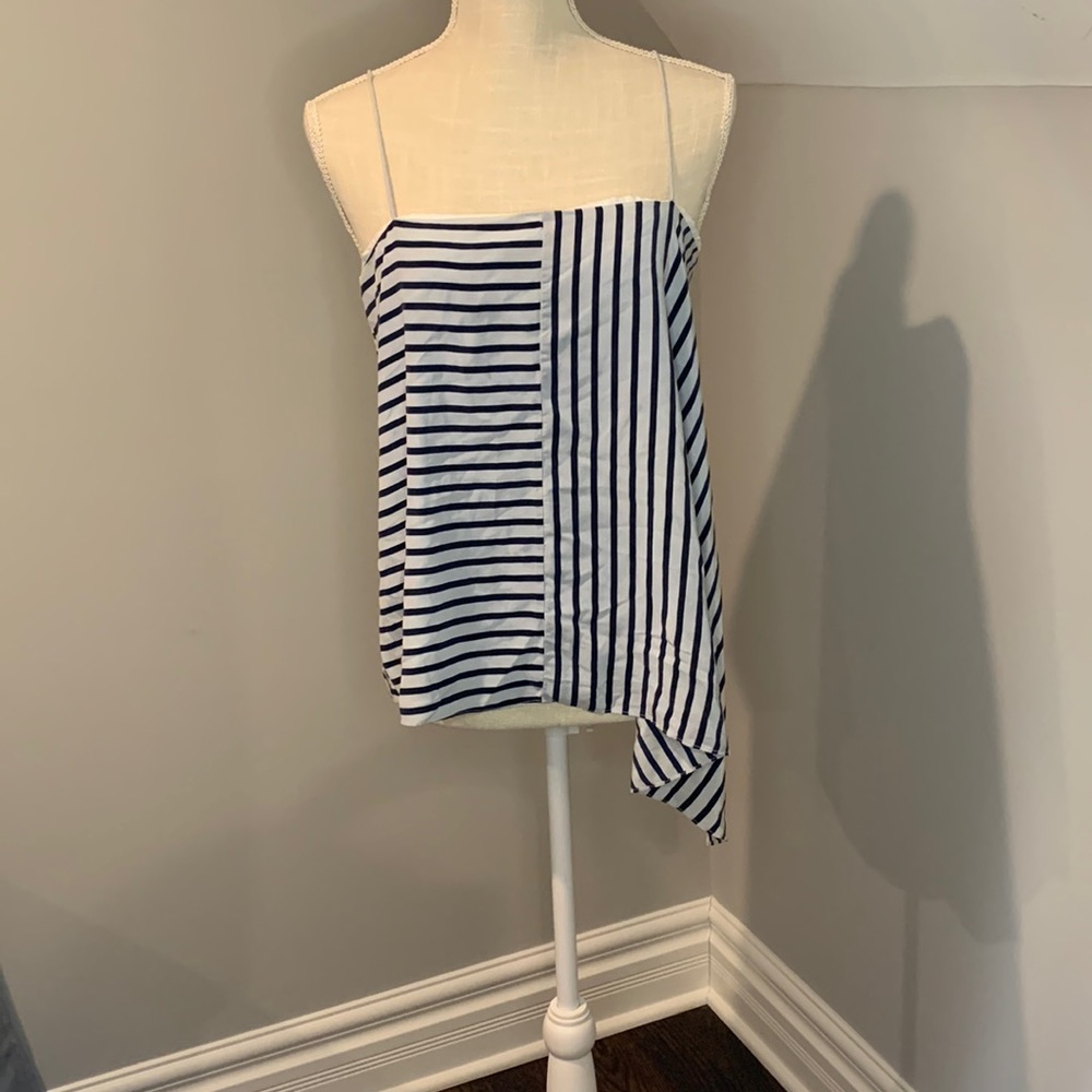 A symmetrical cut top ,size 8 ,light blue with dark blue lines.